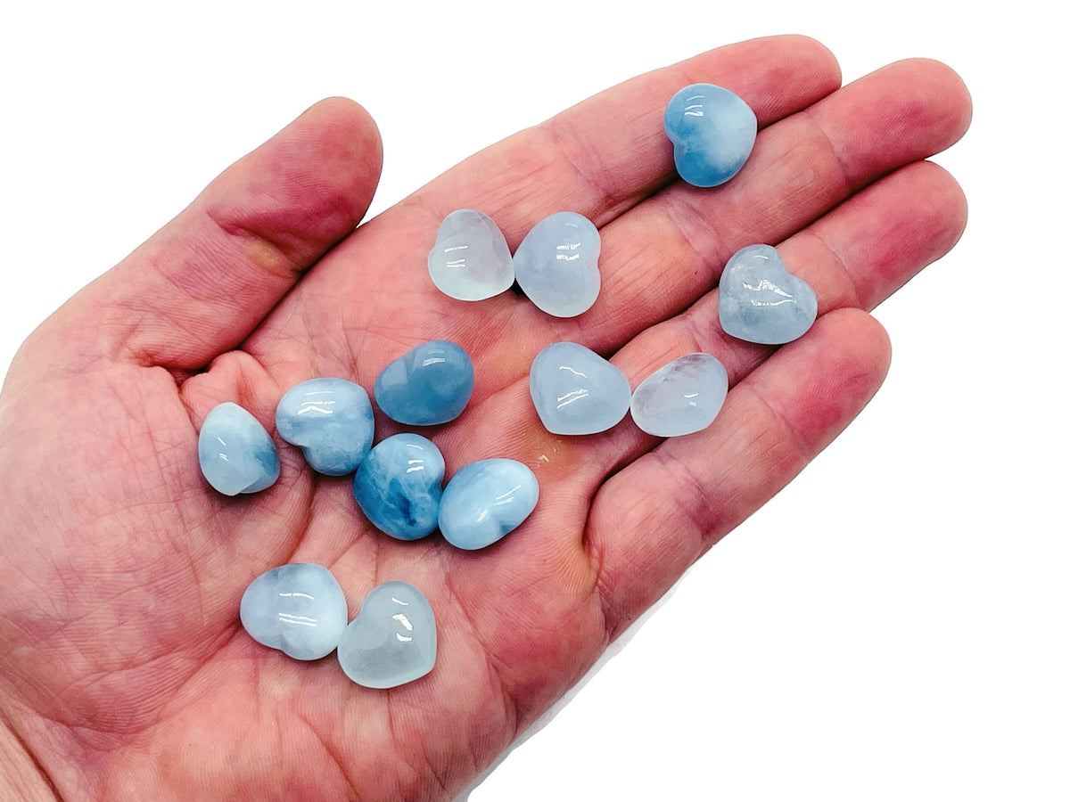 Aquamarine heart-shaped gemstone, 15x15x9mm, from GemstoneGO, showcasing a vibrant blue color and polished surface.