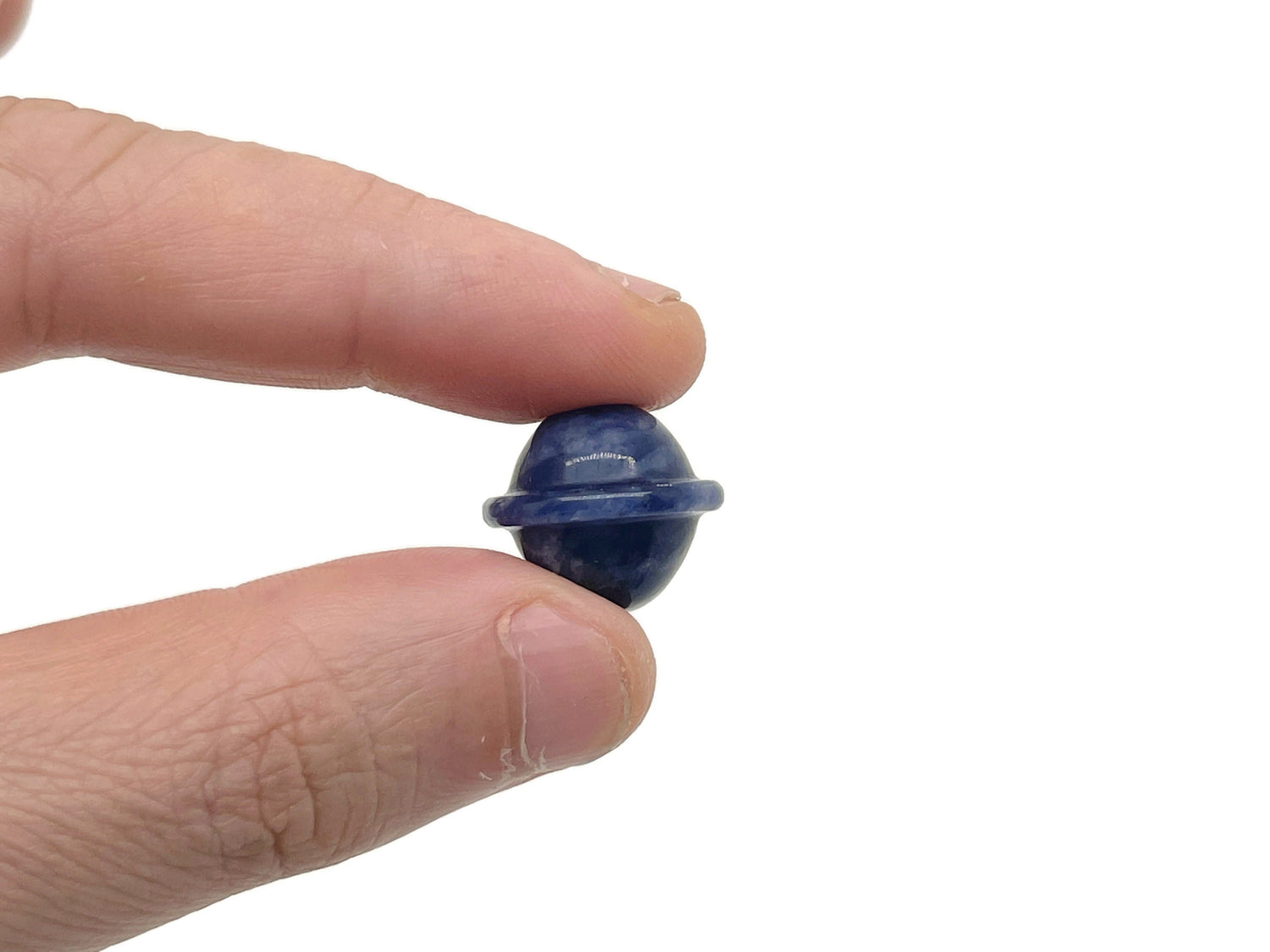 Mini Sodalite Saturn crystal gemstone carved as a planet, 18mm, from GemstoneGO, detailed blue and white gemstone with planetary features.
