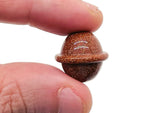 Goldstone Saturn-shaped carved gemstone mini planet, 18mm size, from GemstoneGO, showcasing detailed planetary design and rich golden color.