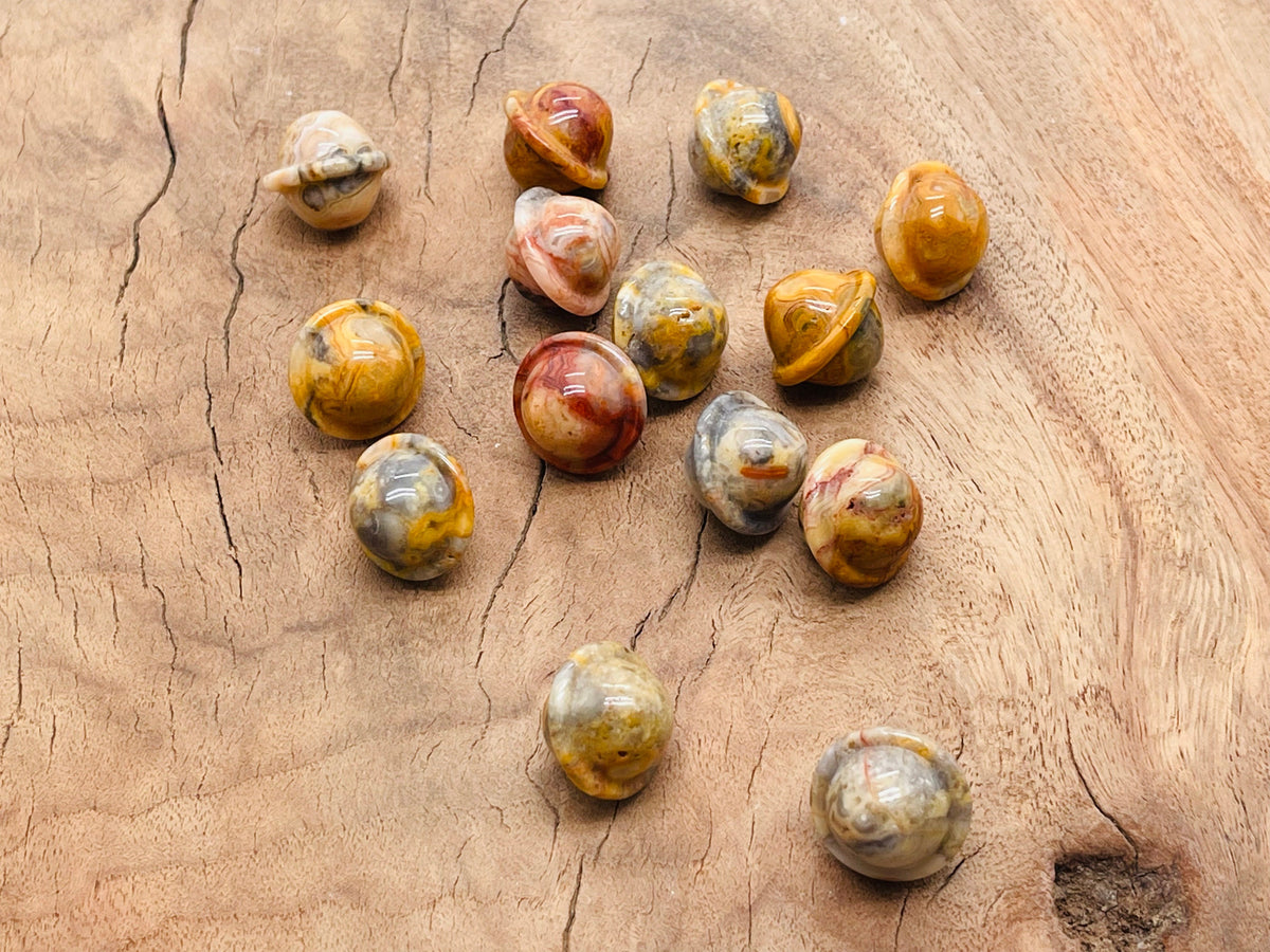 Mini Crazy Lace Agate Saturn gemstone carved as a planet, 18mm, featuring intricate patterns and vibrant natural colors.