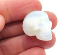 Opalite skull carved gemstone from GemstoneGO, 25mm, featuring a smooth, polished skull design with vibrant opalite colors.
