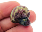 Dragon Blood Jasper skull carved gemstone, 25mm, featuring deep red and brown hues, crafted by GemstoneGO.