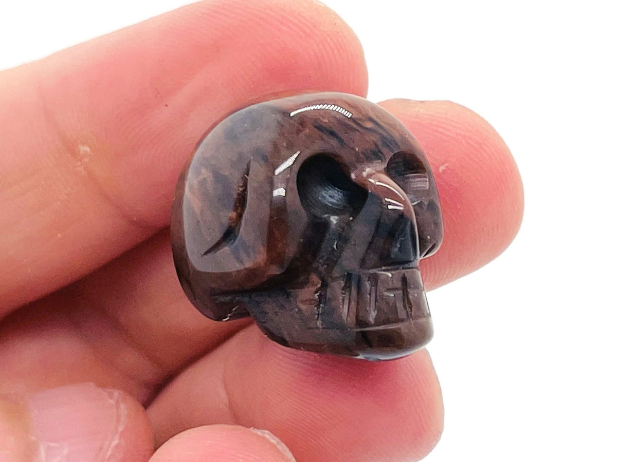 Mahogany Obsidian skull carved gemstone, 25mm, with detailed features and polished surface, from GemstoneGO.