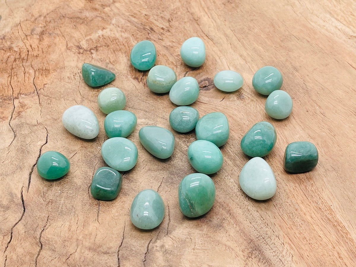 Polished aventurine tumbled gemstone from GemstoneGO, showcasing smooth green stone with natural patterns and glossy finish.