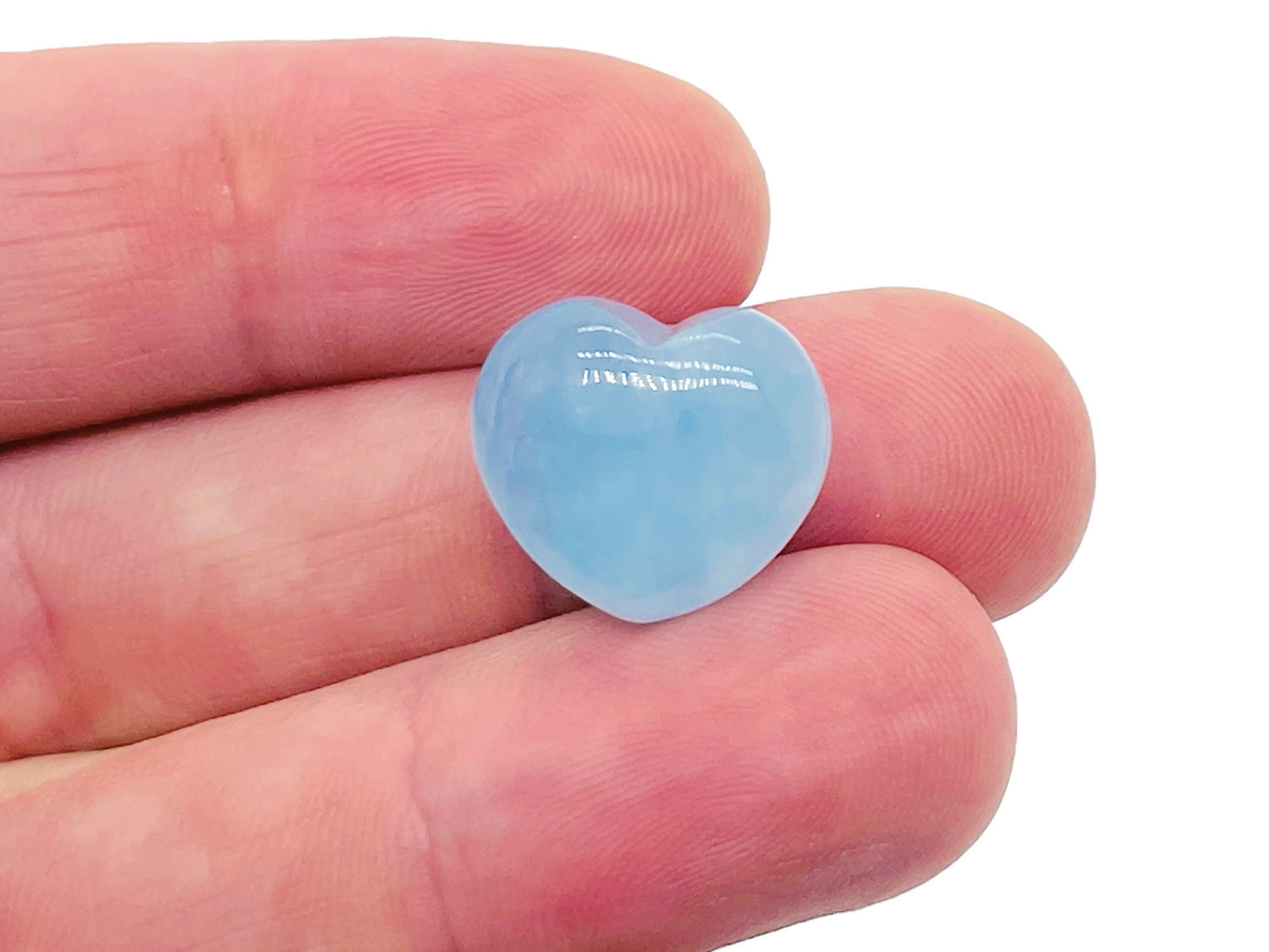 Aquamarine heart-shaped gemstone measuring 15x15x9mm, showcasing a vibrant blue color and polished surface, by GemstoneGO.