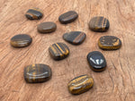 Tiger Eye flat gemstone slab from GemstoneGO showcasing its polished, golden-brown chatoyant surface and natural stone patterns.