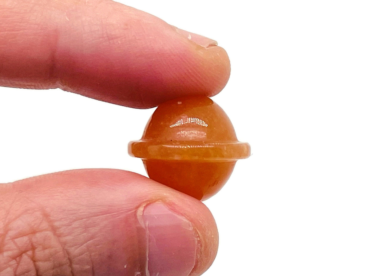 Orange Aventurine Saturn crystal carved mini planet gemstone, 18mm, detailed gemstone with a smooth, polished surface.