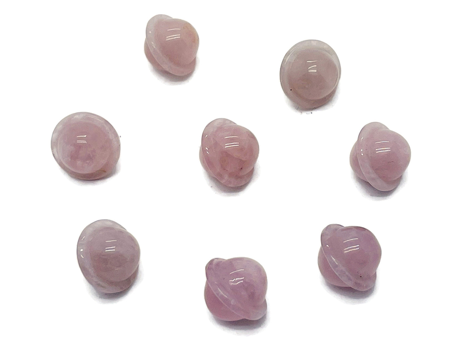 Mini rose quartz Saturn crystal gemstone carved as a small 18mm planet, showcasing a smooth, polished surface with natural pink hues.