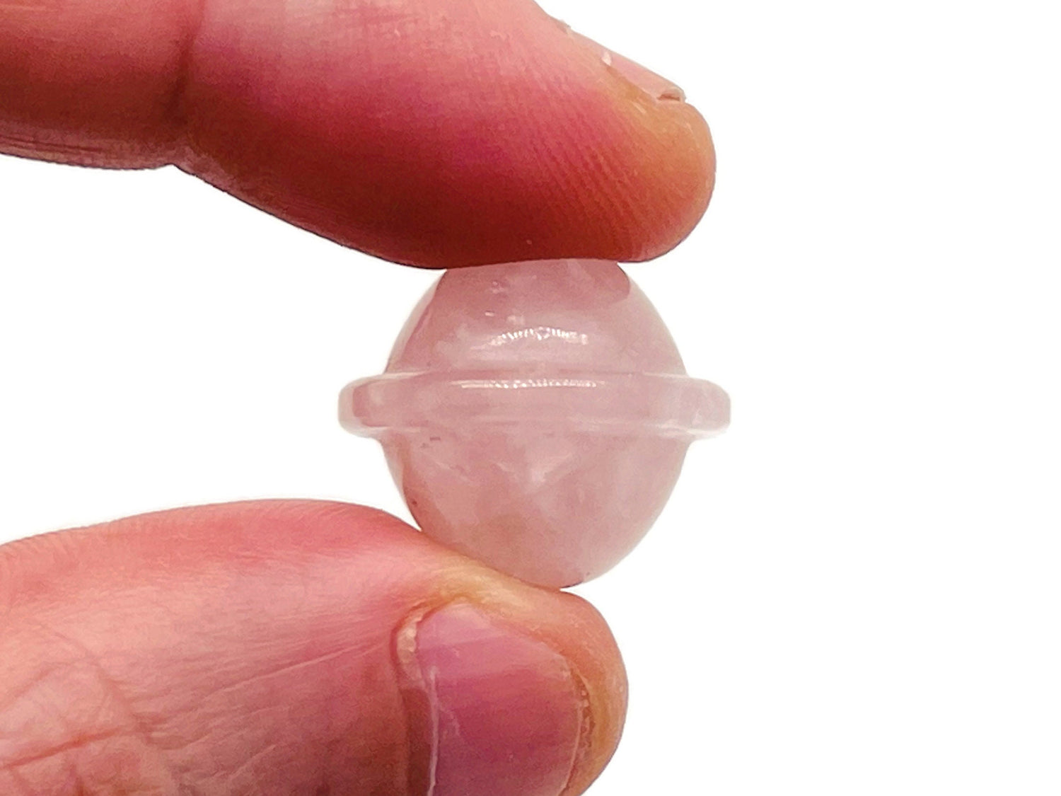 Mini rose quartz Saturn crystal carved as a planetary gemstone, 18mm, showcasing smooth pink stone and detailed ringed planet design.