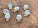 Opalite skull carved gemstone, 25mm, with smooth polished surface and detailed carving, from GemstoneGO.