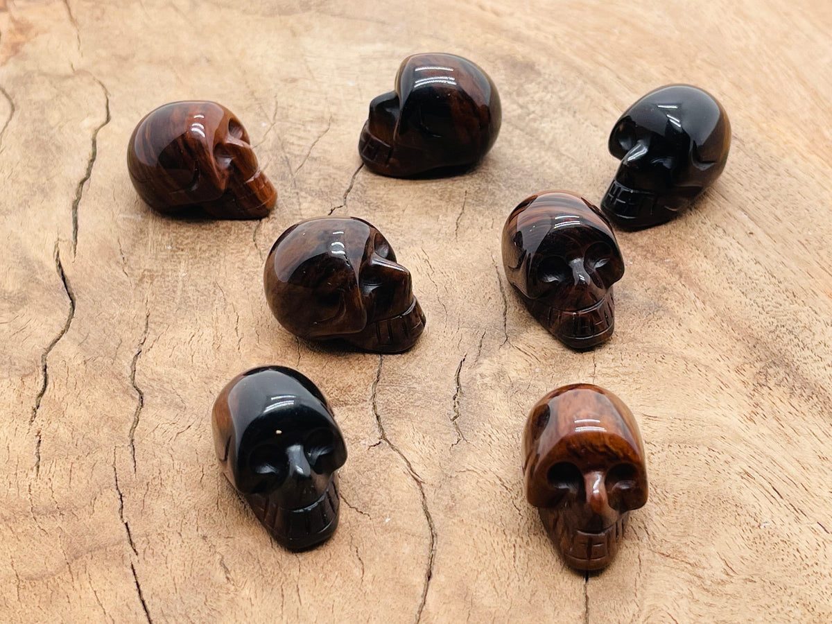Mahogany Obsidian skull carved gemstone, 25mm, with detailed carving and polished finish from GemstoneGO.