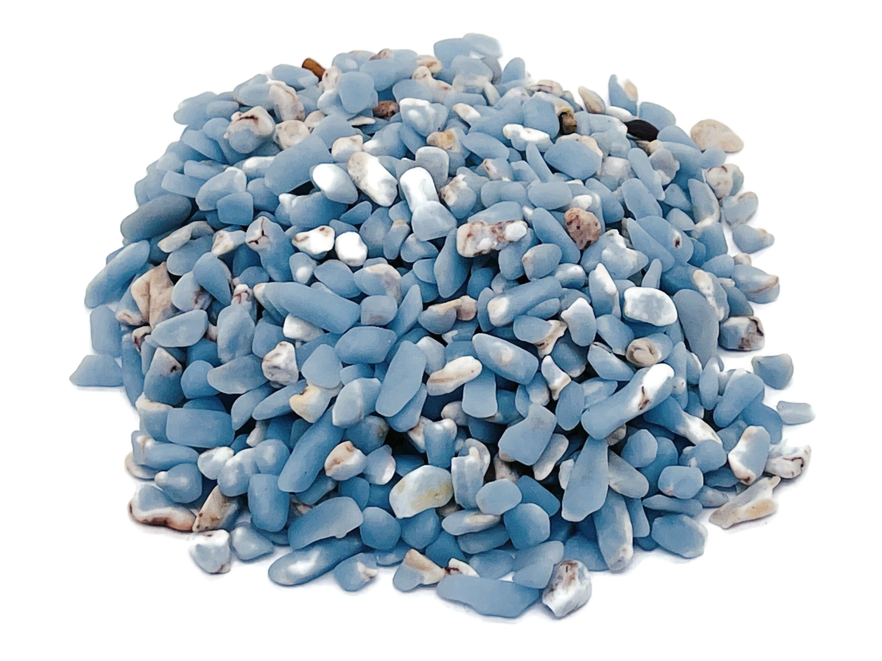Semi-tumbled Angelite crystal chips in 5-7mm, showing smooth, blue-gray gemstone pieces ideal for jewelry or craft projects.