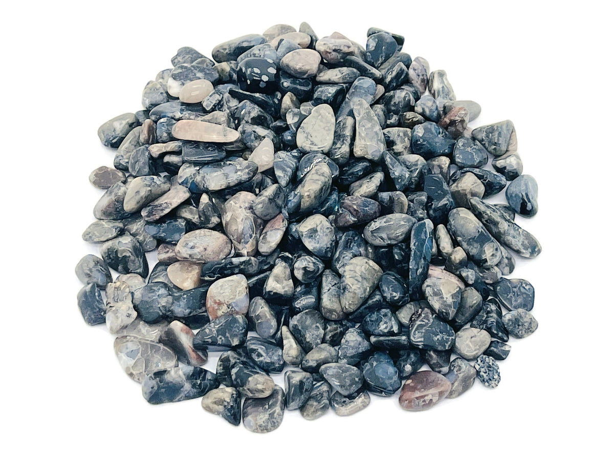 Blue Liberite Que Sera Crystal Chips from GemstoneGO, semi-tumbled 7-9mm bulk gemstones in a natural blue color.