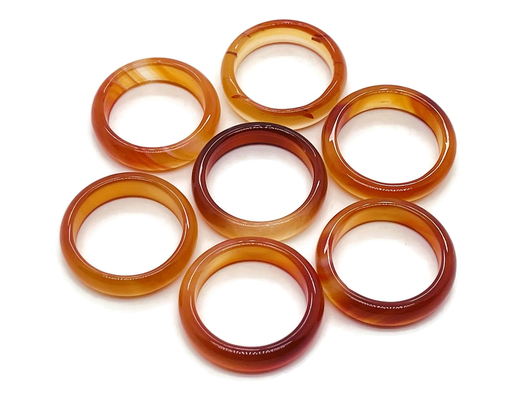 Carnelian crystal ring by GemstoneGO featuring a vibrant orange gemstone set in a silver band.