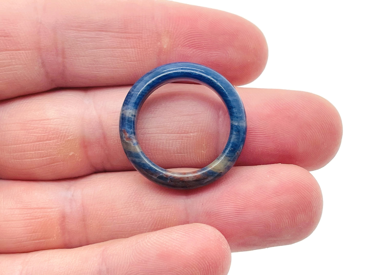Sodalite crystal ring from GemstoneGO featuring a polished blue gemstone set in a silver band.