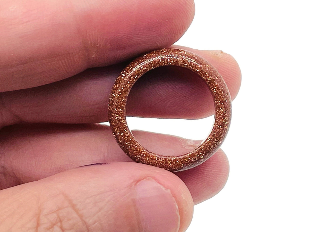 Goldstone Crystal ring by GemstoneGO featuring a sparkling goldstone gemstone set in a sleek band.