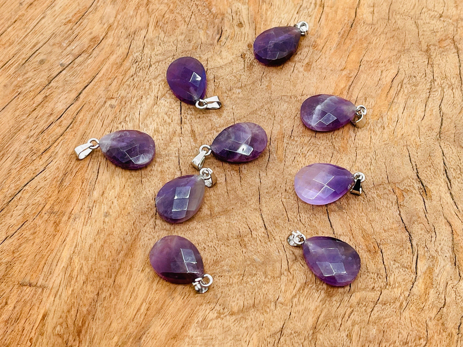 Amethyst crystal pendant, 20mm gemstone for jewelry making, from GemstoneGO, displayed on white background.