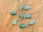 20mm Avunturine crystal pendant by GemstoneGO, perfect for jewelry making, showcasing a vibrant, polished gemstone in a natural setting.
