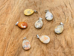 Crazy Lace Agate crystal pendant from GemstoneGO, 20mm, showcasing vibrant, intricate lace-like patterns for jewelry making.