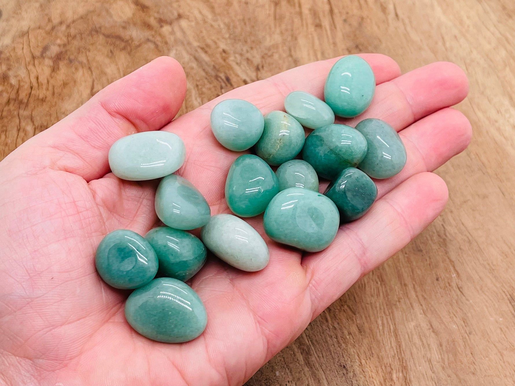 Aventurine tumbled stone from GemstoneGO, smooth green gemstone with natural marbling and shine, ideal for jewelry or spiritual use.