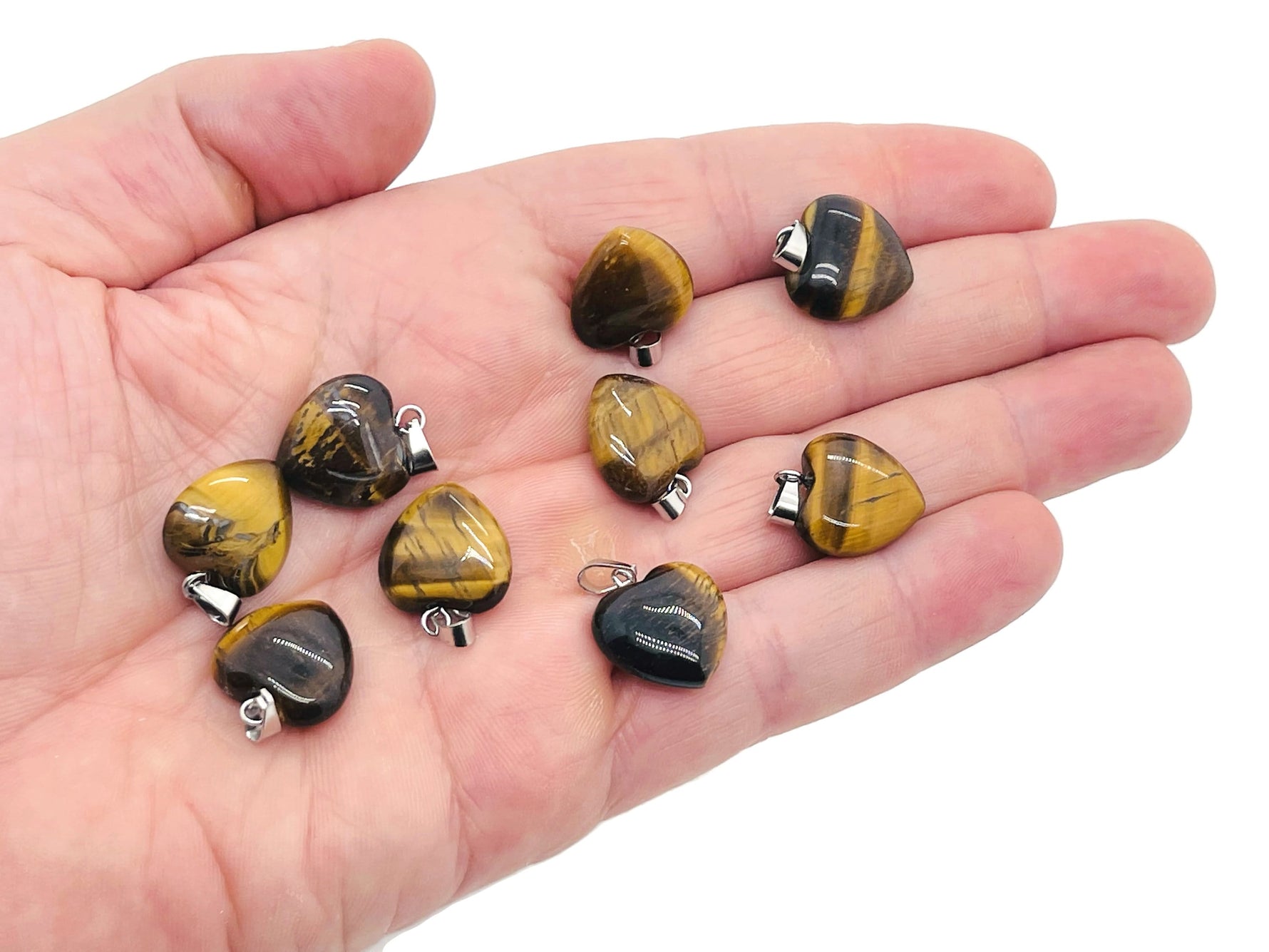 Tiger Eye heart pendant from GemstoneGO featuring a mini crystal heart charm with warm, rich tiger eye stone on a silver chain.