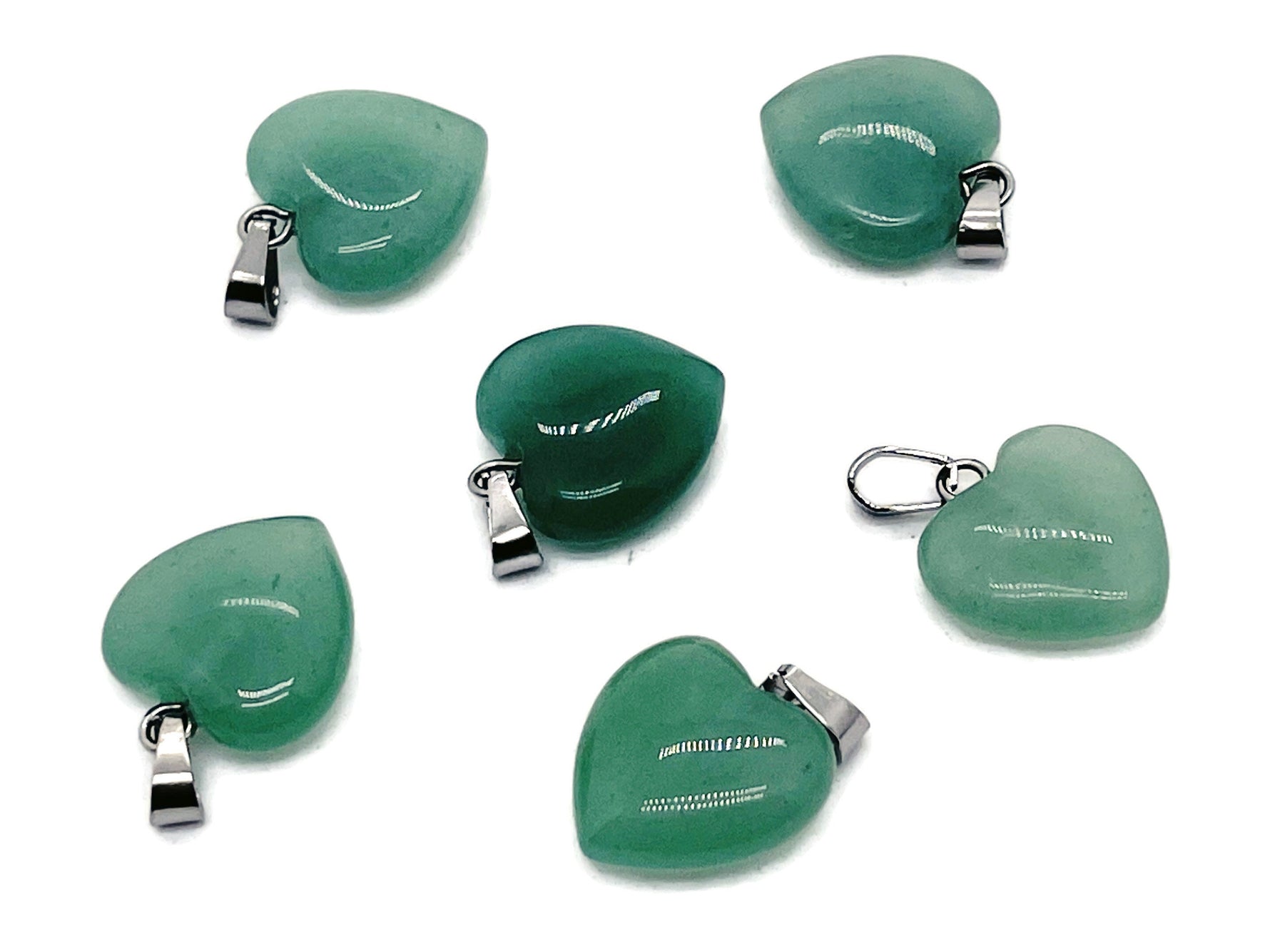 A small aventurine heart pendant with a crystal pendant design, showcasing smooth green gemstone and delicate metal setting.