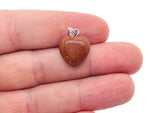 Goldstone heart pendant with mini crystal design by GemstoneGO, showcasing a sparkling gold and brown gemstone heart charm.