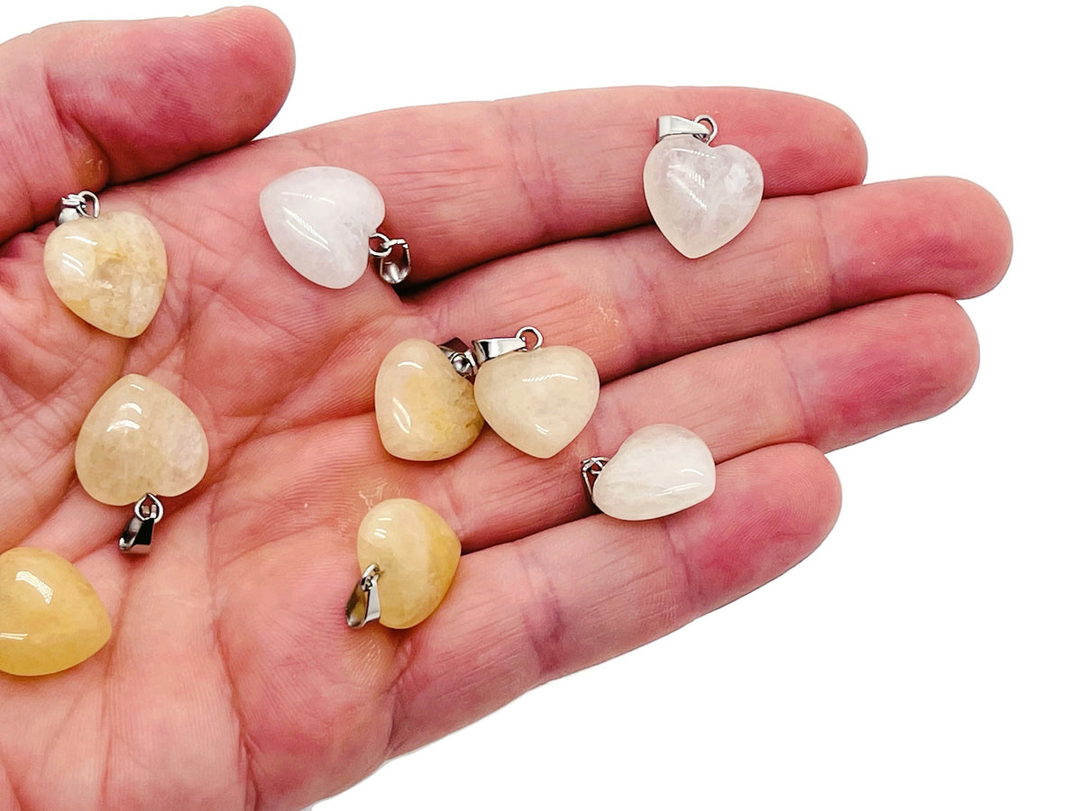 Yellow jade heart pendant with a mini crystal accent from GemstoneGO, showcasing a polished gemstone jewelry piece.