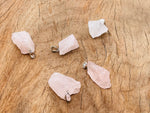 Rose quartz crystal pendant from GemstoneGO featuring a polished teardrop shape and silver-tone bail.