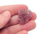 Strawberry Quartz Crystal Pendant by GemstoneGO featuring a polished teardrop-shaped pink gemstone on a silver chain.