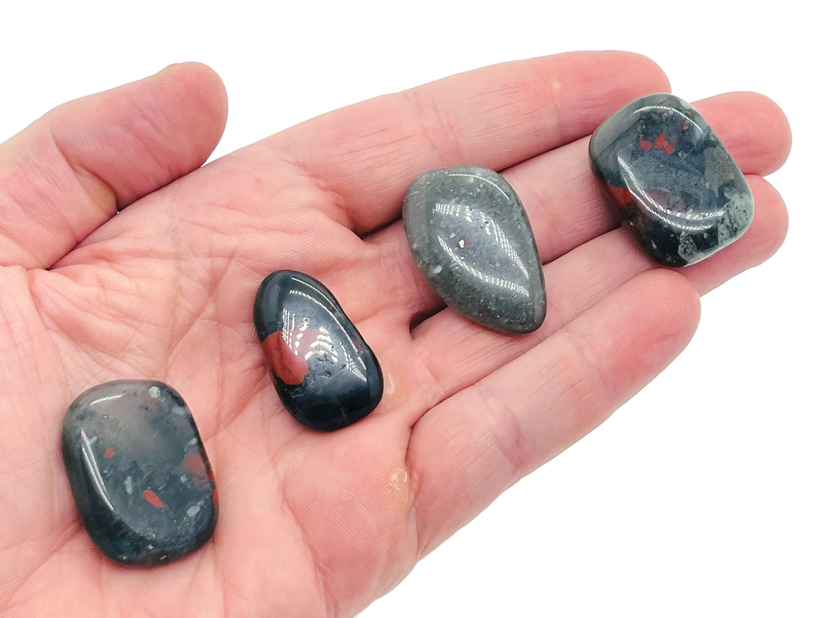 African Bloodstone flat gemstone slab with deep green and red mineral patterns, showcasing natural crystal texture.