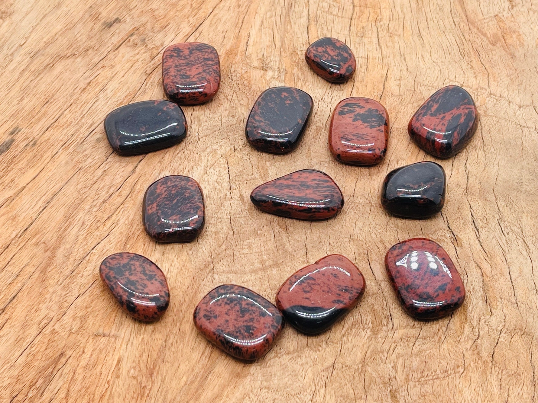 Mahogany Obsidian flat gemstone slab from GemstoneGO showing rich reddish-brown and black swirling patterns.