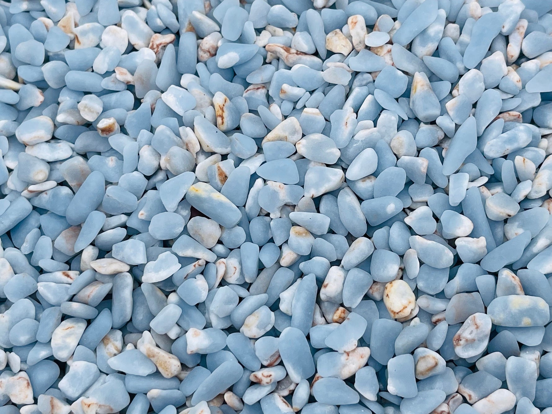 Semi-tumbled Angelite crystal chips in 5-7mm, natural blue gemstone bulk stones from GemstoneGO.