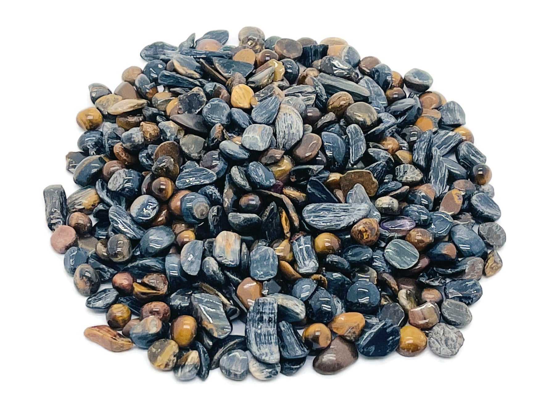 Blue Tiger Eye crystal chips from GemstoneGO, semi-tumbled 5-7mm stones, vibrant blue and golden-brown gemstone bulk lot.