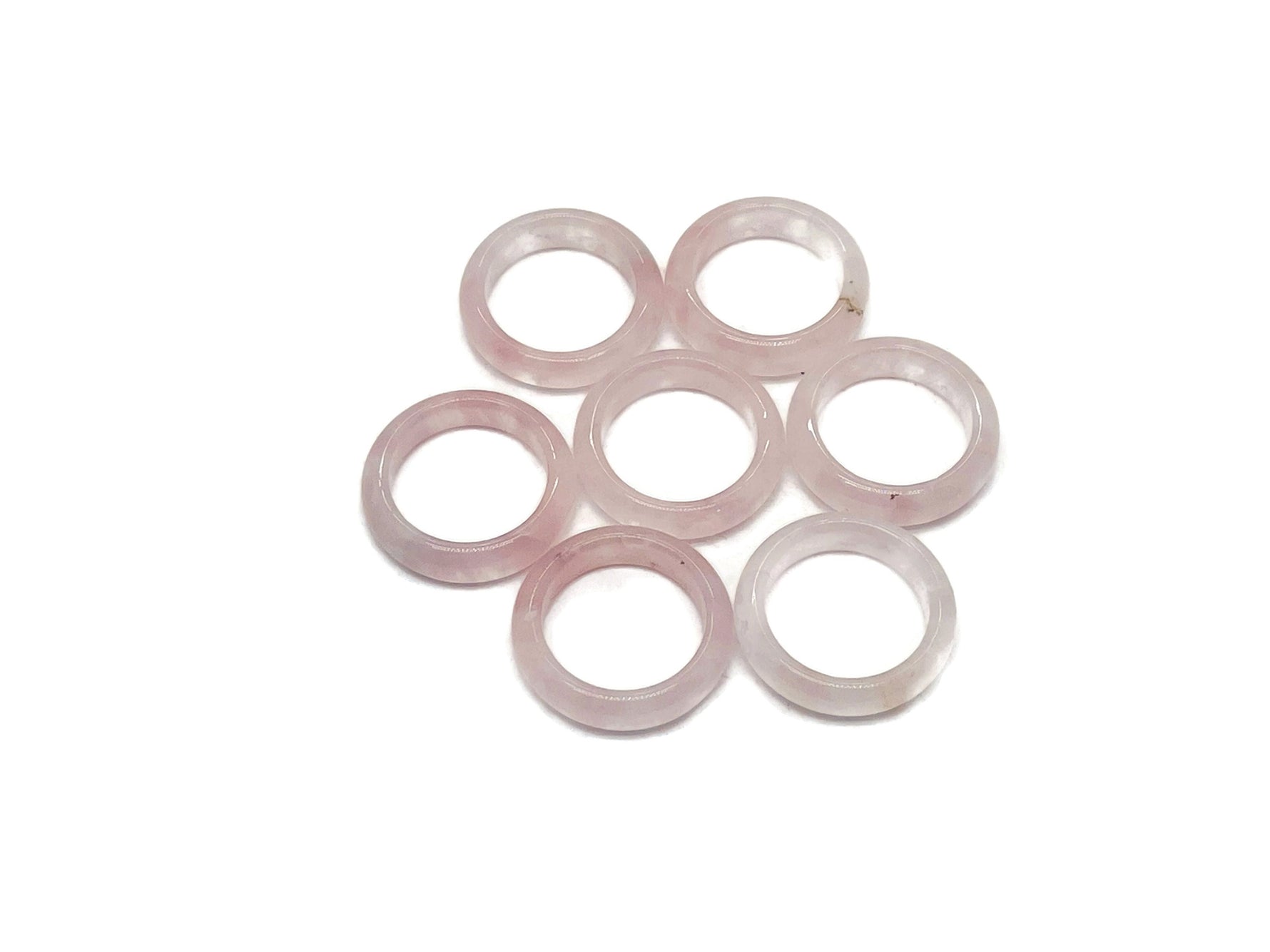 Rose quartz crystal ring by GemstoneGO featuring a polished pink quartz stone set in a silver band.