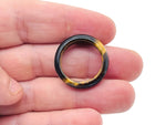 Tiger Eye crystal ring by GemstoneGO featuring a polished golden-brown gemstone set in a silver band.