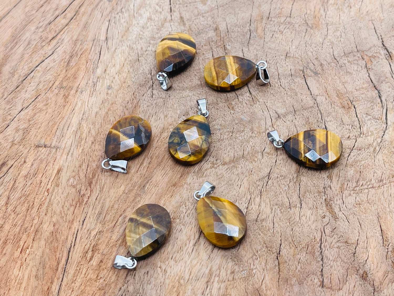 Tiger Eye crystal pendant, 20mm gemstone for jewelry making, from GemstoneGO, showcasing polished, golden-brown stone with natural patterns.