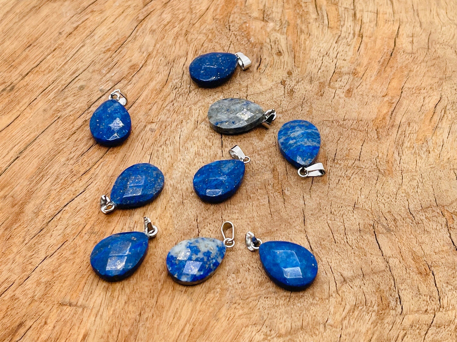 Lapis Lazuli crystal pendant, 20mm, gemstone jewelry making supply from GemstoneGO, with deep blue and gold flecked surface.