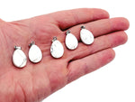 20mm Howlite crystal pendant from GemstoneGO, ideal for jewelry making, showcasing a smooth, white and gray veined stone.