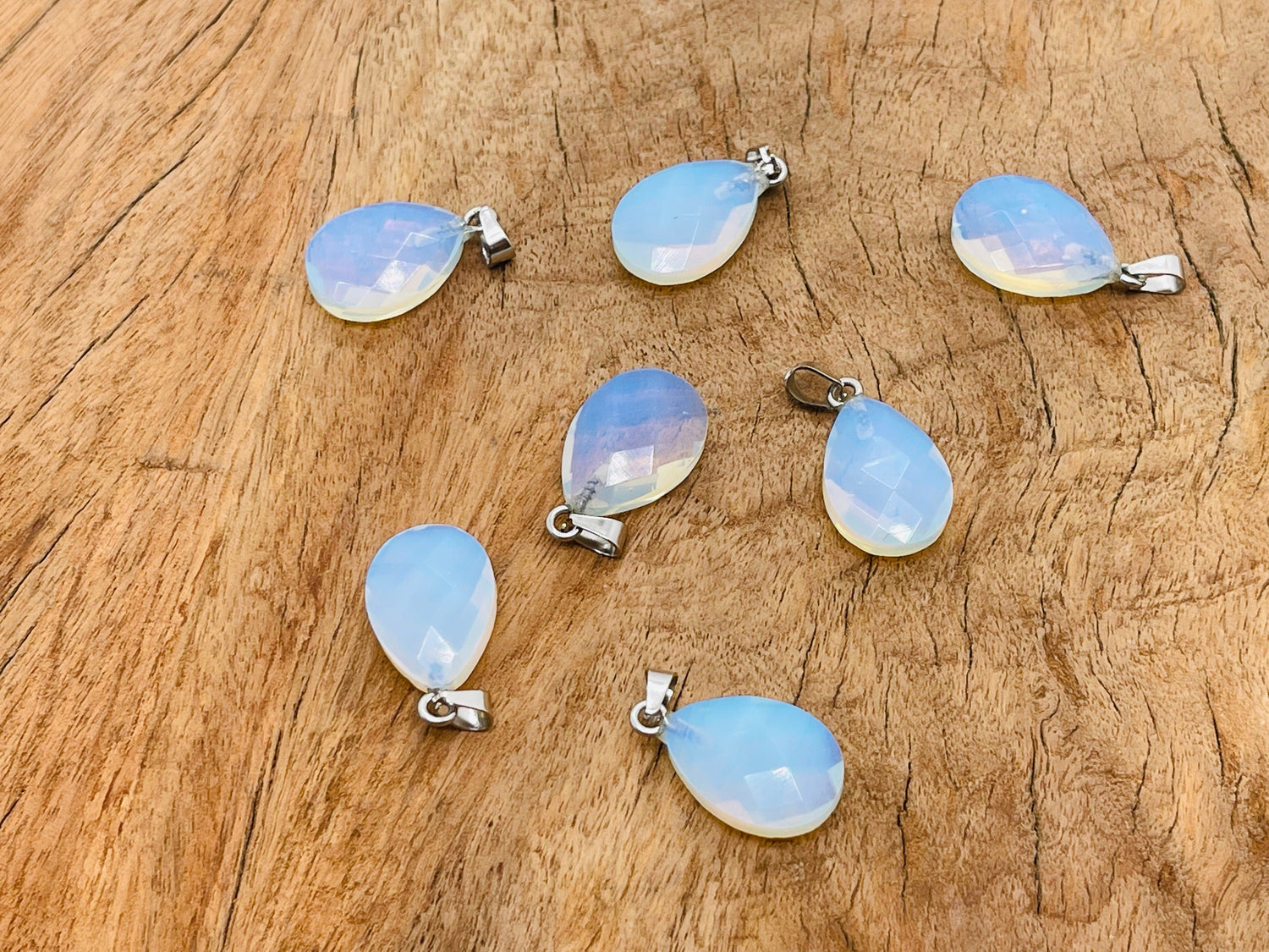 Opalite crystal pendant, 20mm gemstone for jewelry making, smooth oval shape with a soft glow, from GemstoneGO.