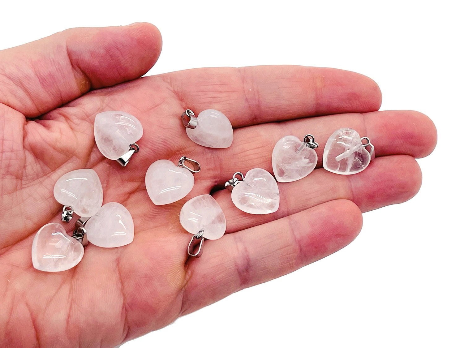 Clear quartz heart pendant from GemstoneGO, small crystal jewelry piece with a polished, transparent gemstone heart shape.