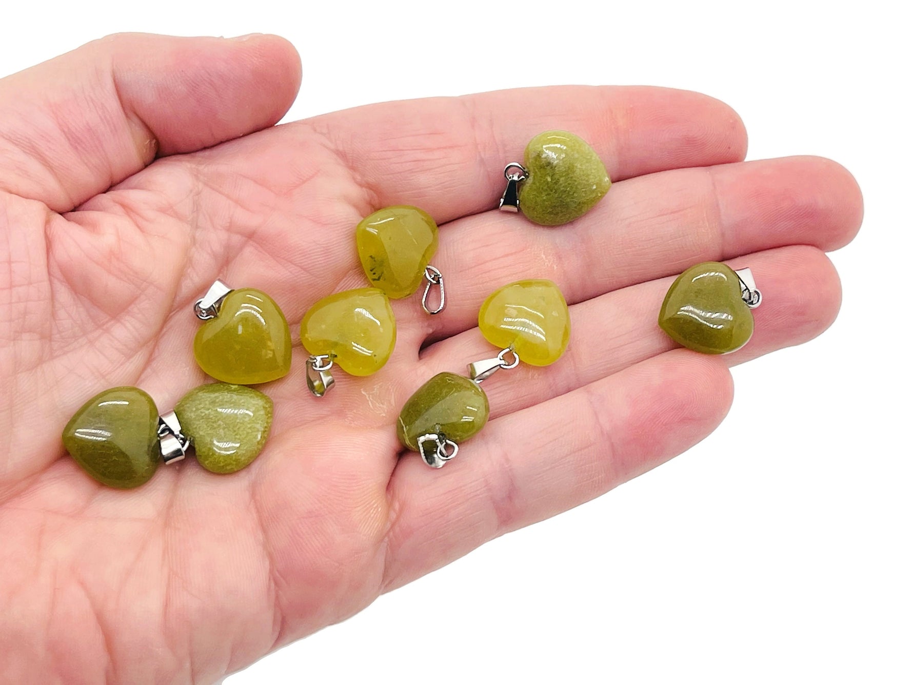 Nephrite jade heart pendant from GemstoneGO, mini crystal pendant with smooth green jade, elegant jewelry piece.