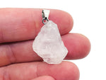 Clear quartz crystal pendant from GemstoneGO featuring a polished, transparent gemstone on a silver chain.