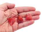 Cherry quartz crystal pendant from GemstoneGO featuring a polished cherry-red quartz stone hanging on a delicate silver chain.