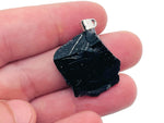 Obsidian crystal pendant from GemstoneGO featuring a polished black gemstone with a silver bail on a chain.