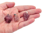 Strawberry quartz crystal pendant from GemstoneGO featuring a polished teardrop-shaped gemstone with a silver bail.