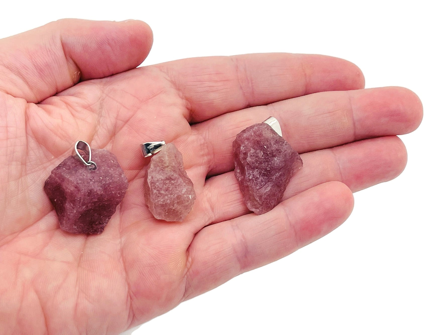 Strawberry quartz crystal pendant from GemstoneGO featuring a polished teardrop-shaped gemstone with a silver bail.