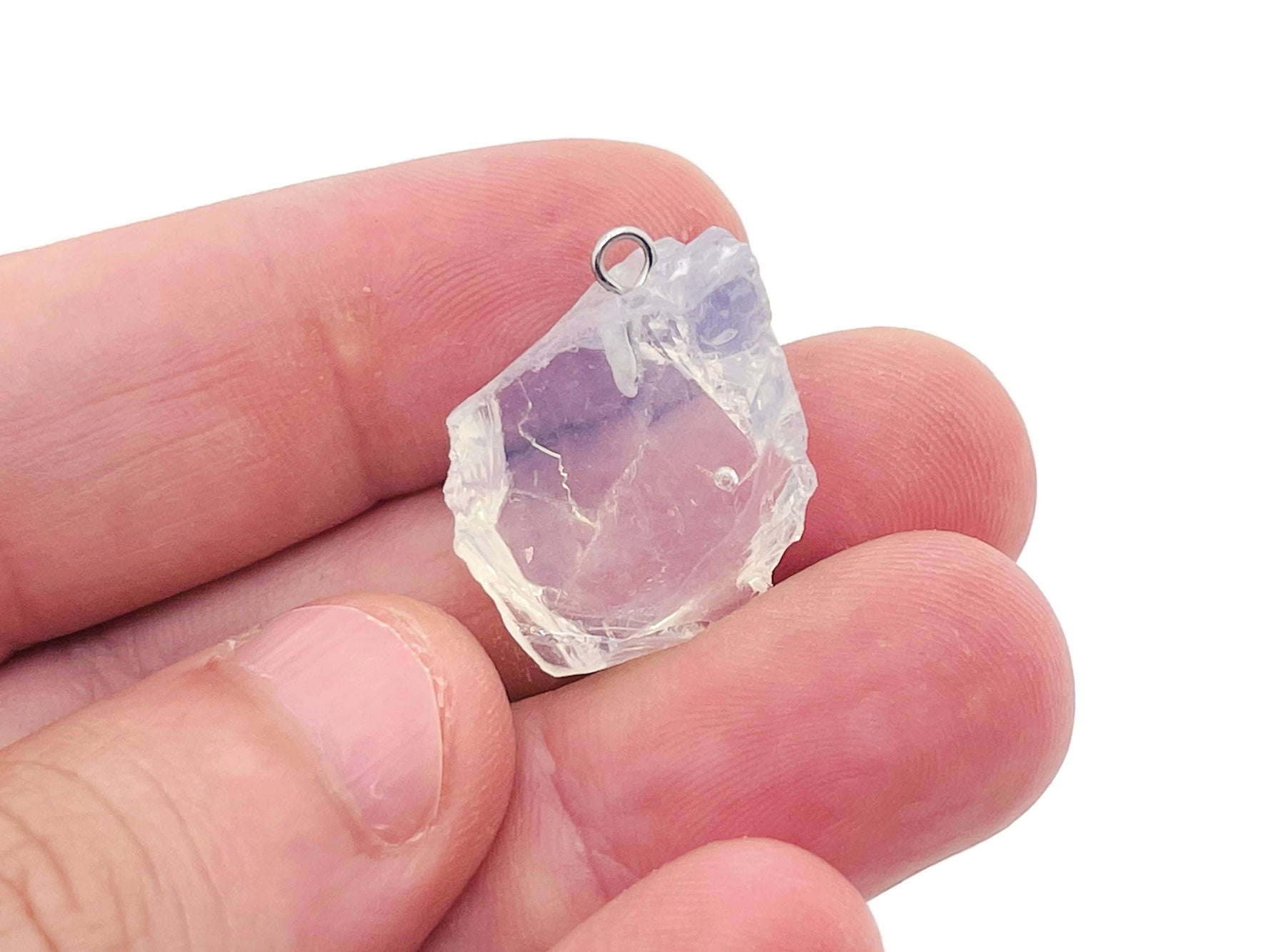 Opalite crystal pendant from GemstoneGO featuring a smooth, oval-shaped gemstone on a silver chain.