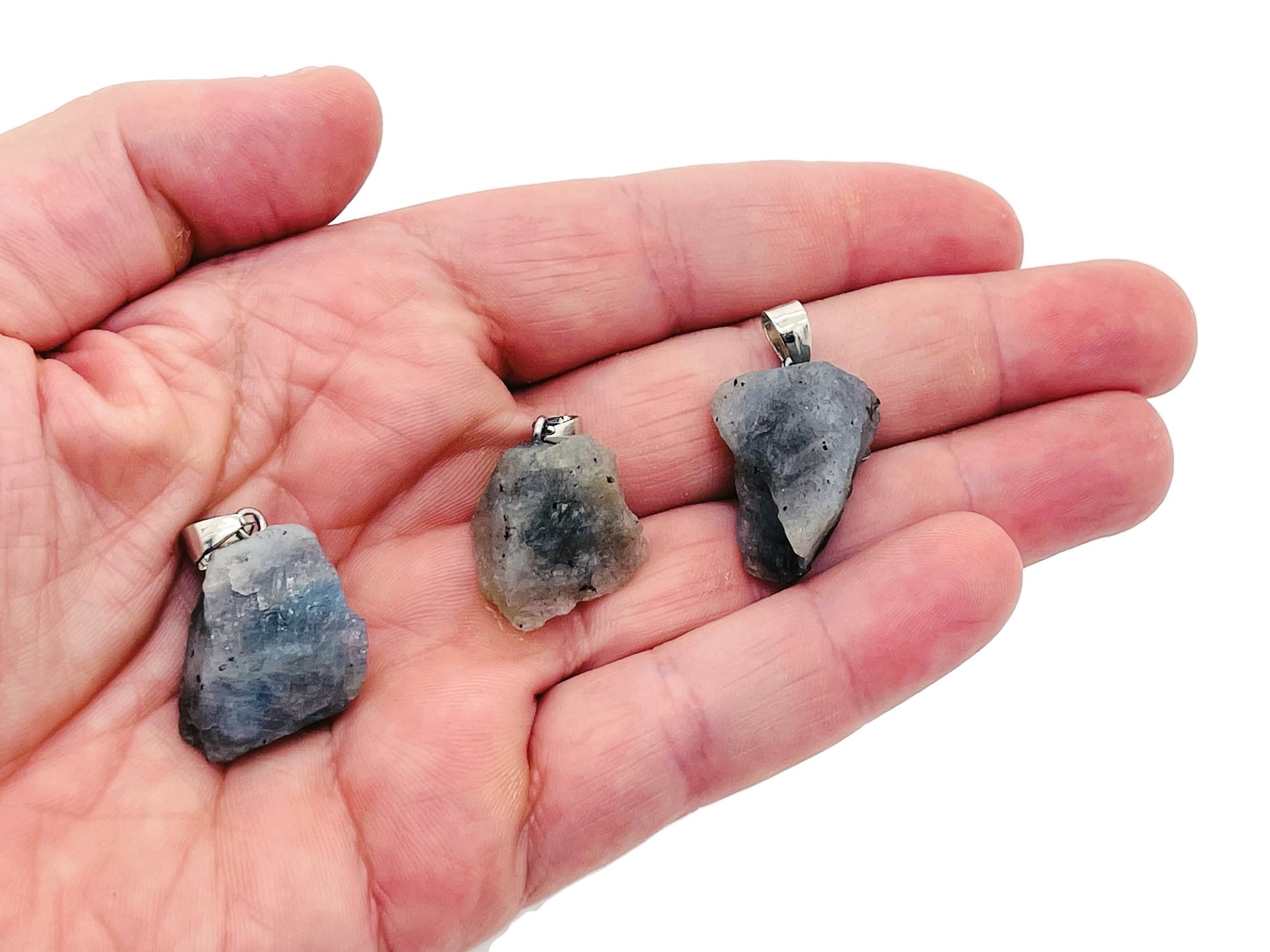 Labradorite crystal pendant from GemstoneGO featuring a polished, iridescent stone on a silver chain.