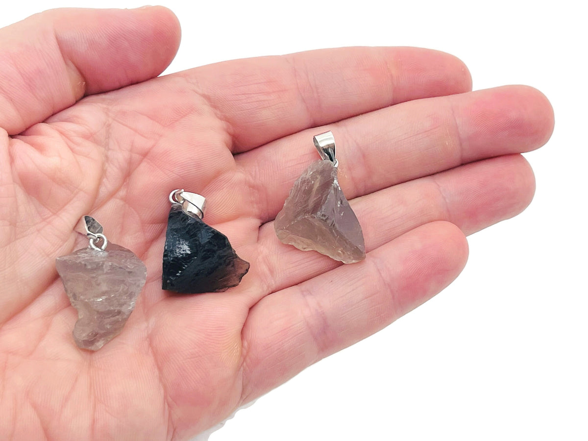 Smoky quartz crystal pendant from GemstoneGO featuring a polished teardrop-shaped gemstone on a silver chain.